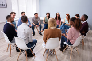 Young,Multiracial,Millennial,Friends,Sitting,In,Circle,Having,Group,Discussion